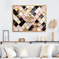 a living room with white couches and gold accents on the wall above it is a chandelier