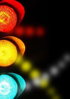 a traffic light that is red, yellow and green