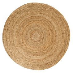 the round rug is made from natural jute and has been placed on a white surface