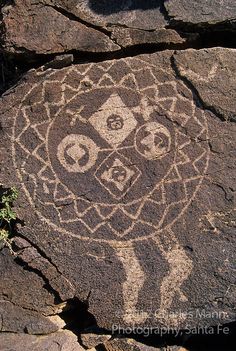 a rock with some designs on it