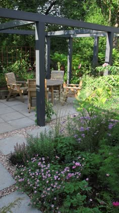 a garden with flowers and plants around it