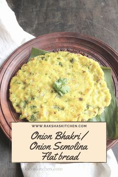 an omelet with broccoli is on a plate next to a napkin