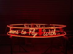 a neon sign that says, hearts to fly with