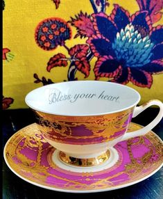 a cup and saucer sitting on top of a table