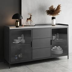 a black and white sideboard with glass doors