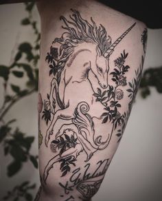 a black and white photo of a unicorn on the leg