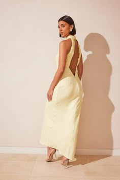 Look no further than the CLAIRE Satin Drape Back Maxi Dress for a timeless and elegant impression at your next special event. Showcasing a minimalistic silhouette, Claire is transformed with her striking open-back that will have you turning heads. Accompanied by statement accessories, she makes the perfect piece for weddings, work functions or celebratory dinners. Meshki Claire Dress, Neutral Dresses Formal, Satin Yellow Dress, Light Yellow Dress, Satin Drape Dress, Midi Dress Layering, Dress Minimal, Dresses Date Night, Yellow Maxi Dress