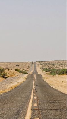 an empty road in the middle of nowhere