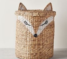 a woven basket with a fox face on it