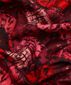 a red and black abstract print fabric