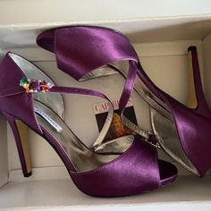 Brand New In The Box Size 9 Open Toes With Cross Foot Strap And Pretty Multi Color Jeweled Buckle. 4" Heels Never Worn Except In The Store. Fitted Purple Heels With 4-inch Heel, Purple Sandals With 4-inch Heel And Open Heel, Purple Synthetic Heels With 4-inch Heel, Purple Heels With 4-inch Pointed Toe, Purple Pointed Toe Heels With 4-inch Heel, Purple And Gold Wedding, Satin Heels, Purple Satin, Purple Gold