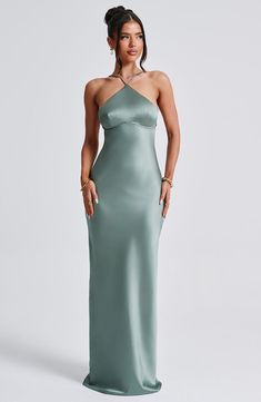 The sleek, sexy lines of Sinead in Sage is everything we want and more this season. In an gorgeous peach tone, this maxi is cut from our luxe non-stretch satin which skims the figure, designed with a super chic neckline that's high and narrow. The low V-shaped back is the main character, with self tie detail for that perfect fit.Ã‚Â 



Colour: Sage.

Premium non-stretch satin.

Fully lined.

Beautifully skims over figure.

High, narrow neckline.

Shaped under bust with piping.

Low V-shaped bac Sage Prom Dress, Moh Dress, Homecoming Dresses Corset, White Dress Spring, Midi Dress Wedding Guest, Split Long Dress, Dress Sage, Maxi Dress Sale, Sparkle Dress