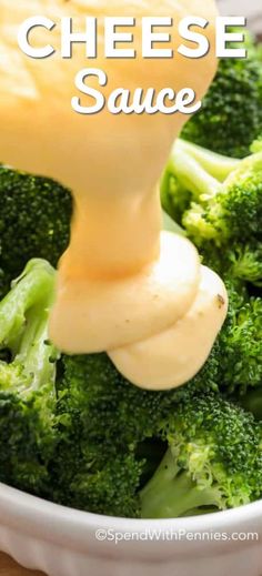 broccoli is being drizzled with cheese sauce in a white bowl