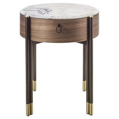 a marble topped end table with two brass legs and an oval shaped top, on a white background