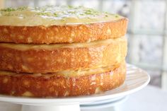 a three layer cake sitting on top of a white plate