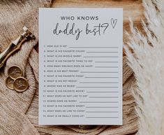 a card that says who knows daddy best? next to a pair of gold scissors