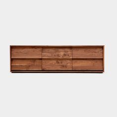 the sideboard is made out of wood and has four drawers, one with two open doors