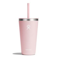 a pink tumbler cup with a straw sticking out of the top and lid, on a white background