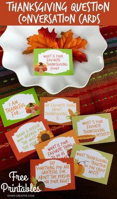 thanksgiving question conversation cards on a plate with fall leaves and pumpkins in the background