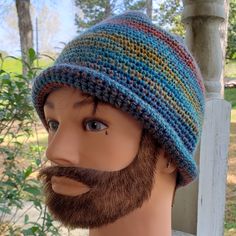 a male mannequin wearing a multicolored knitted hat