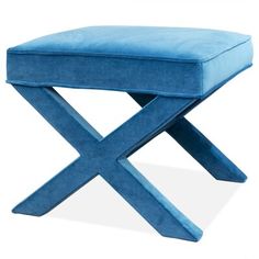 a blue foot stool sitting on top of a white floor