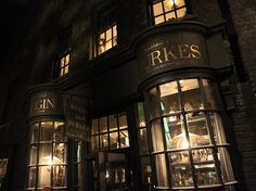 a store front at night with lit up windows