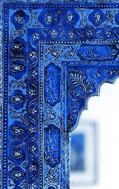 an intricately designed blue and white wall