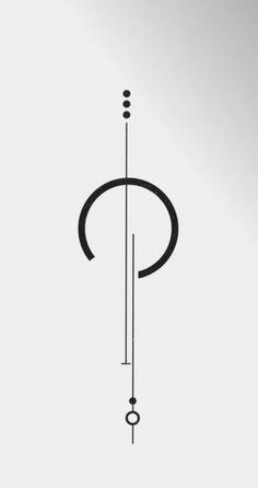 a black and white photo of a clock on a pole with an arrow in the middle