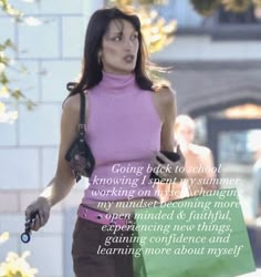 a woman walking down the street with a shopping bag in her hand and a quote about going back to school