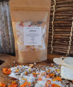 Herbal Bath Salt- Sunrise is a rejuvenating blend to help you find balance and peace.  Made with a mixture of epsom salts, eucalyptus, lemongrass, orange and lemon essential oils. Each bag also has dried herbs and flowers.  Each bag also comes with a reusable muslin cotton bag and a wooden spoon. Directions: pour herbal bath salts in reusable cotton bag, tie draw string tight and place in bath water to let " steep" for 5-10 minutes. Get in, relax and enjoy the health benefits and soothing aromas Herb Socks For Baths, Eucalyptus Bath Salts, Bath Salts Packaging Ideas, Orange Bath Salts, Herbal Bath Salts, Citrus Bath, Herbs And Flowers, Sugar Scrub Recipe, Herbal Bath