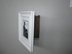 an open white frame hanging on the wall