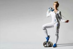 a woman in white and blue is standing on one leg while holding a pair of headphones to her ear