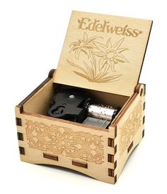 PRICES MAY VARY. Real music box: wind-up mechanism, no need to rotating the handle all the time. Decor: A unique music box gifts. Gifts: It's a cute gift whether it's for kids, friends or family. Collection: A nice collection for someone. Mini sized: The edelweiss music box is portable and fit into the palm of your hand. 
Product Name: Edelweiss Music Box. 
Material: Wood. 
Process: Laser engraving + Hand assembled. 
Usage: Gifts/ Knickknack/ Desk/bookshelf decorations. Musical Box, Bookshelf Desk, Laser Cut Jewelry, Palm Of Your Hand, Bookshelf Decor, Brooches Handmade, Music Box, Wooden Decor, Wooden Boxes