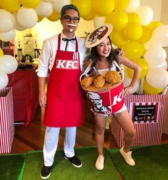 a man and woman dressed up as kfc characters with food in front of them