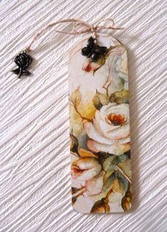 a bookmark with flowers painted on it