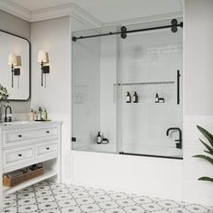 a bathroom with a sink, mirror and bathtub