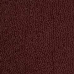 a close up view of a red leather texture