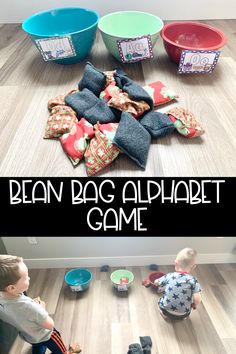 two boys sitting on the floor playing with bean bag alphabet game