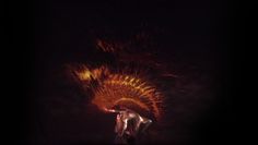 a man standing in front of a firework display