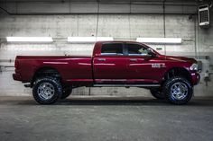 a large red truck parked in a garage