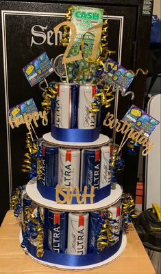 a birthday cake made out of cans and confetti