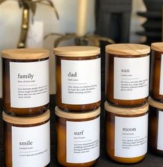 six jars of peanut butter sitting on top of a table