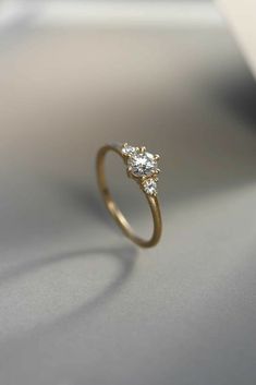 a diamond ring sitting on top of a table