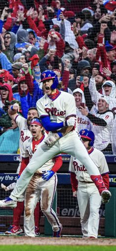 the baseball players are celebrating on the field