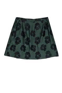 We can always count on Tory Burch to make a stand out piece for any occasion. This silk and cotton blend A-line skirt is an ideal transitional piece, pairing well with a black crop top in the summer or layering with a cardigan and tall boots come time for fall. The wrap style and button details at the waist are perfectly put together with the floral print. Size 10 Shell: 54% Silk, 46% Cotton Lining: 100% Polyester Wrap style w/ gold-toned button closures Lined A-line silhouette Dual front welt p Chic Cotton A-line Mini Skirt, Green Cotton Mini Skirt For Work, Fitted A-line Green Skirt, Green Full Cotton Skirt, Green Cotton Mini Skirt, Fitted Full Green Mini Skirt, Green Cotton Pleated Mini Skirt, Green Mini Skirt For Work, Green Cotton Mini Skirt For Summer