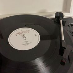 an old record player with the word music on it's side and its turntable