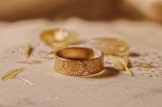 "Copy and paste into your browser, get 15% off ➔ https://bit.ly/VD15OFF Like wildflowers, you must allow yourself to grow in all the places people never thought you would. DETAILS: -Each ring is hand stamped -Ring is 14/20 Gold Filled -6mm in thickness You will receive one hand-stamped gold filled ring with no enamel filling. **Every item is handmade, this means that each will be unique and may not look EXACTLY like the picture, but it will look very similar ➡ORDER PROBLEMS If there are any prob Allow Yourself To Grow, Hand Stamped Ring, Stamped Ring, Best Friend Birthday Gift, Mystical Jewelry, Sunflower Ring, Steel Stamp, Stamped Rings, Friend Birthday Gift