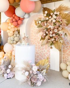 an assortment of balloons and flowers on display