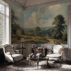 a living room filled with furniture and a painting on the wall