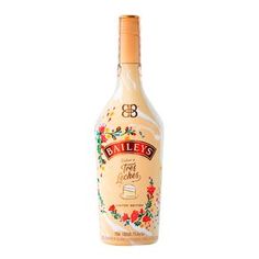 a bottle of bailey's irish cream liqueur on a white background with red flowers